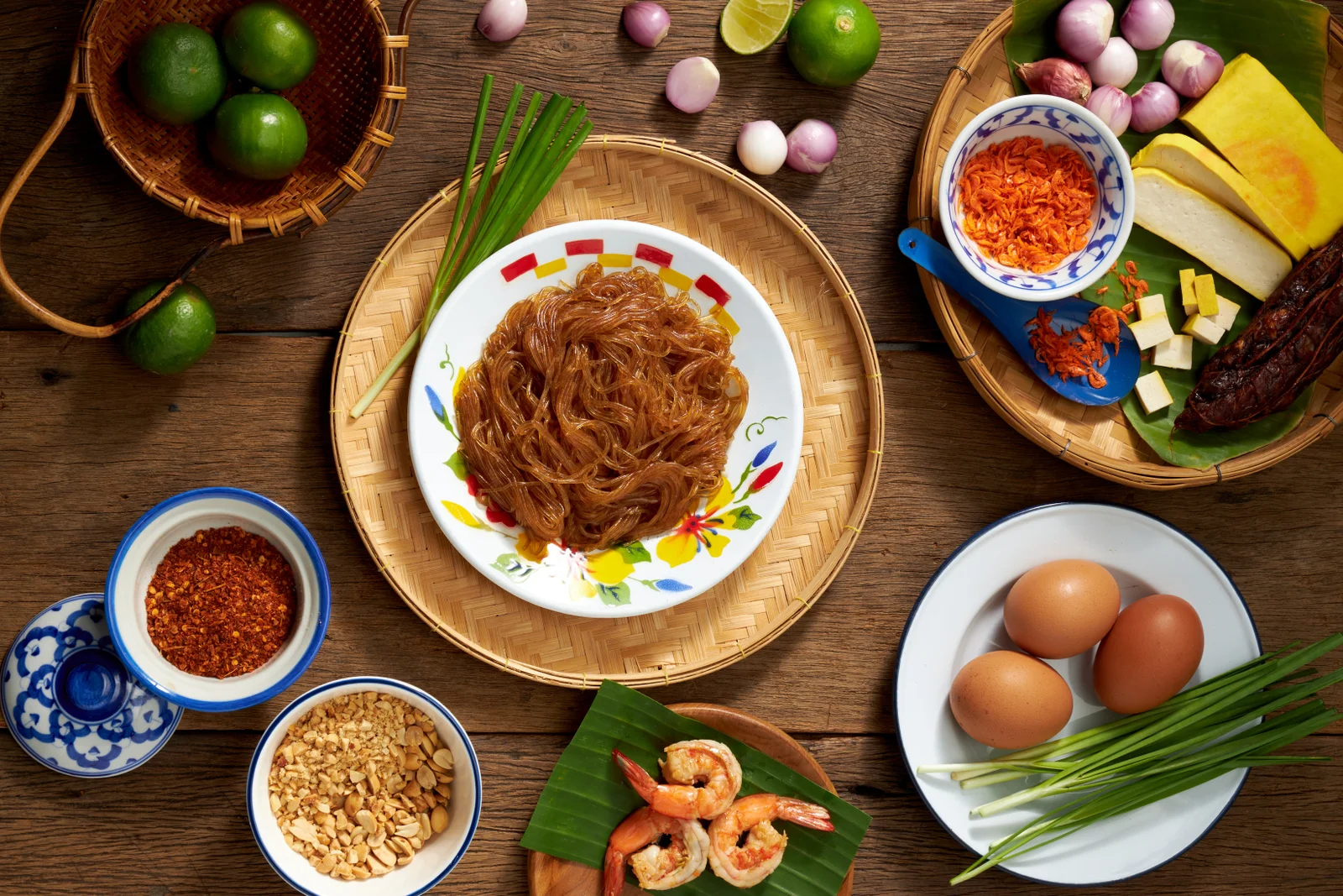 Pad Thai ingredients arranged around a Thai table